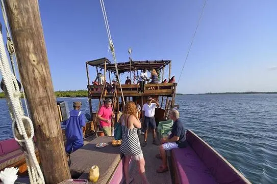 Travellers enjoying a sunset dhow cruise on Mida Creek Watamu
